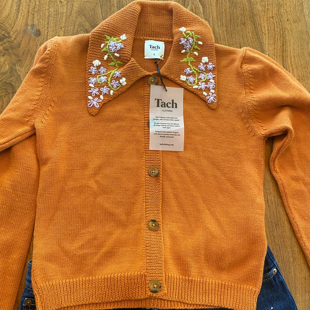 Tach designer sweater with embroidered collar.  https://www.tachclothing.com